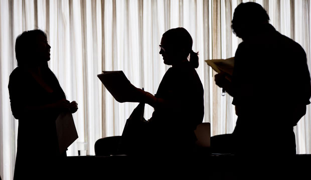 A recruiter meets with employment seekers during a job fair in Philadelphia, June 2014. (AP/ Matt Rourke)