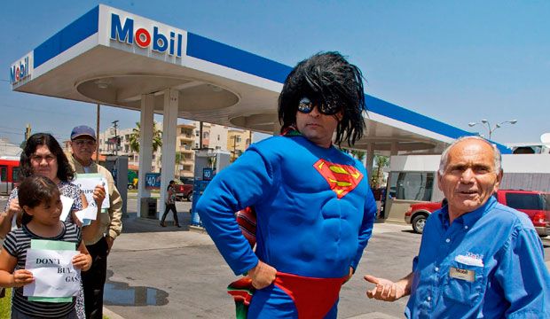 Demonstrator Norberto Gonzalez wears a Superman costume as he joins consumers to protest the high cost of gasoline in June 2008. (AP/Damian Dovarganes)
