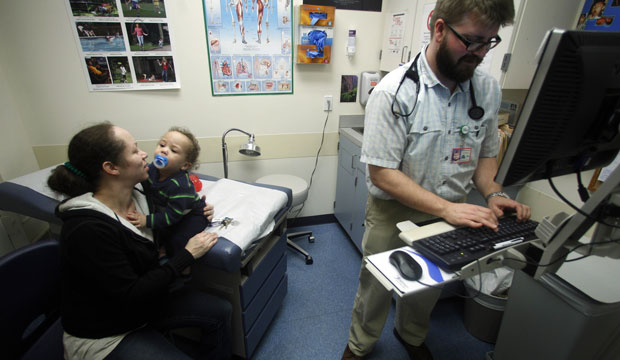 An overhaul of the Medicaid system in Oregon aims to improve coordination of care between county-run health clinics, hospitals, doctor’s offices, and mental health providers. (AP/Rick Bowmer)