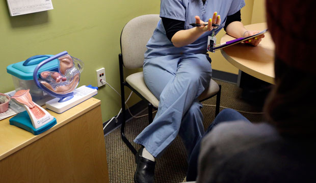 A medical clinician interviews a patient at a Planned Parenthood location in Boston. (AP/Steven Senne)