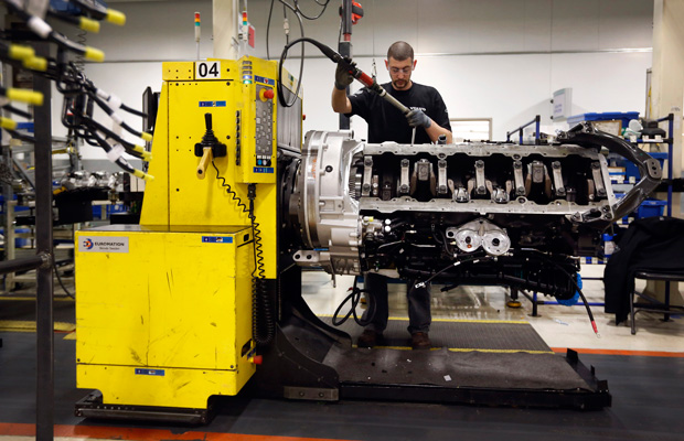 Jon Wyand works on a truck engine assembly line at Volvo Trucks' powertrain manufacturing facility in Hagerstown, Maryland. (AP/Patrick Semansky)
