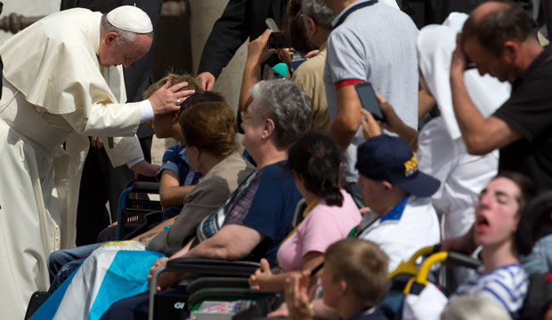 Pope Francis blesses sick people at the end of his weekly general audience in St. Peter's Square, September 10, 2014. (AP/Andrew Medichini)