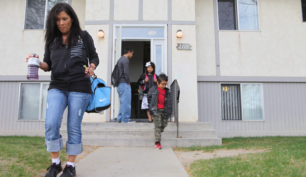 Lexi Country and her four children leave for school in Helena, Montana. Country is a Native American and has just graduated from Helena College, a two-year institution that provides busy students programs to keep them in school. (AP/Kathryn Haake)