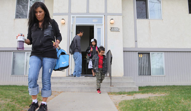 Lexi Country and her four children leave for school in Helena, Montana. Country is a Native American and has just graduated from Helena College, a two-year institution that provides busy students programs to keep them in school. (AP/Kathryn Haake)