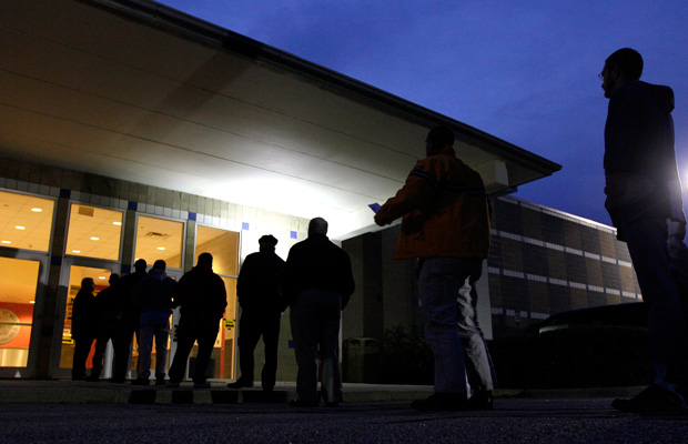 Voters stand in line before sunrise to cast their votes in Apex, North Carolina, on Election Day 2012. (AP/Gerry Broome)