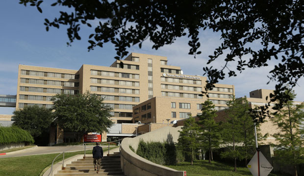 A man walks up the stairway leading to the Texas Health Presbyterian Hospital in Dallas, Texas, September 30, 2014. (AP/LM Otero)