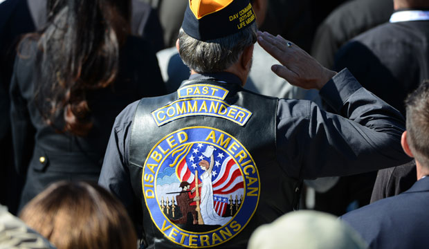 A U.S. war veteran salutes during the dedication ceremony for the American Veterans Disabled for Life Memorial in Washington, D.C., October 5, 2014. (AP/Molly Riley)