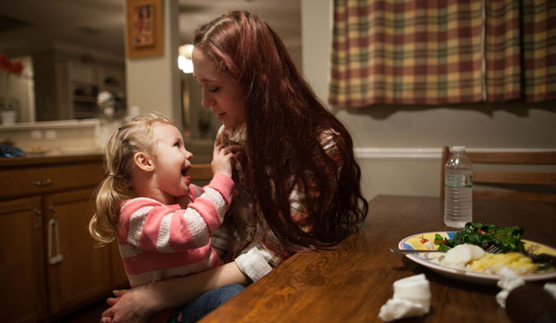 Maggie Barcellano sits with her daughter, Zoe, 3. Barcellano receives food stamps to help feed her daughter. (AP/Tamir Kalifa)