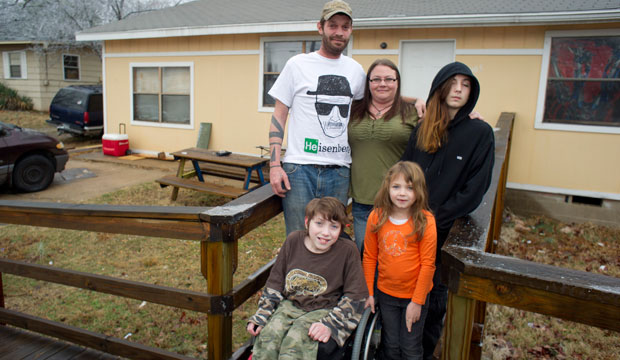 Lori Latch with her husband Chad; son Marcus, right rear; son Eric, front left; and daughter Ruby at their home in North Little Rock, Arkansas. (AP/Brian Chilson)