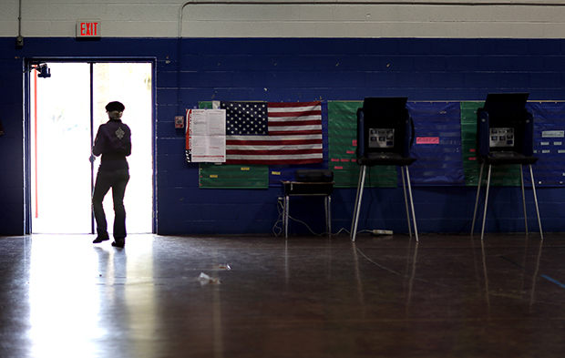 A voter leaves the Bells Elementary School polling place for Colleton County, Tuesday, November 4, 2014, in Ruffin, South Carolina. (AP/Stephen B. Morton)