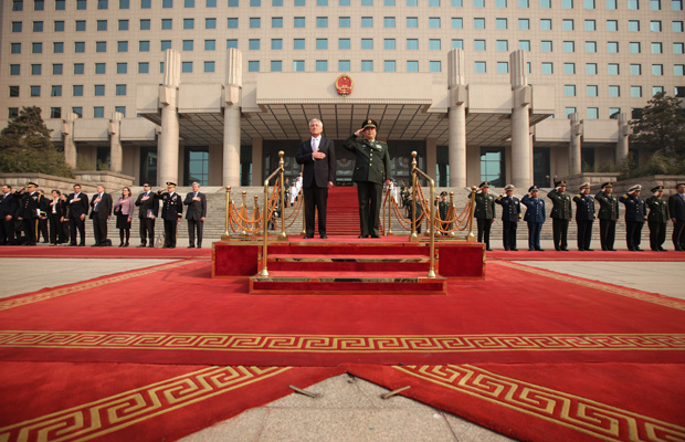 U.S. Defense Secretary Chuck Hagel and Chinese Minister of Defense Chang Wanquan listen to the U.S. national anthem during a welcome ceremony in Beijing, April 8, 2014. (AP/Alex Wong)