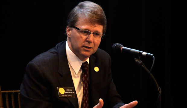 Chief Justice Mark Martin responds to a question during the North Carolina Supreme Court Candidate Forum in Raleigh on September 17, 2014. (AP/Gerry Broome)