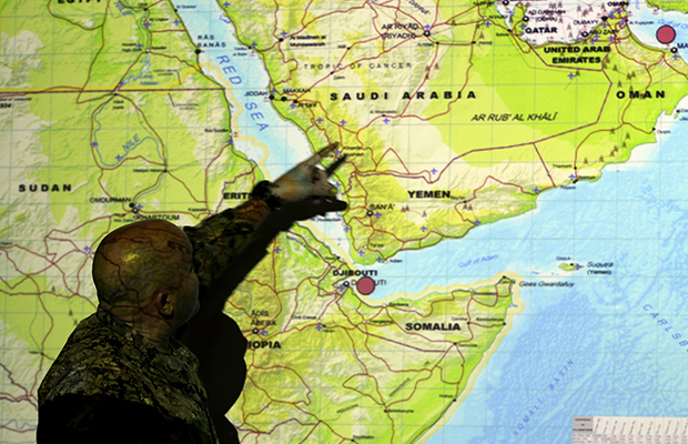 U.S. Navy Commander Jason Salata of Santa Ana, California, points to a map ahead of a briefing for journalists at the U.S. Navy base in Manama, Bahrain, September 20, 2012. (AP/Hasan Jamali)