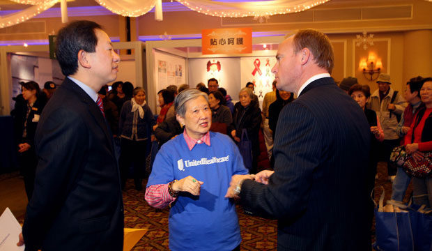 Lee Sheut-Hing, center, discusses how her insurance agency's health and wellness programs have helped her achieve better health with representatives from UnitedHealthcare. (Rick Maiman/AP for UnitedHealthcare)