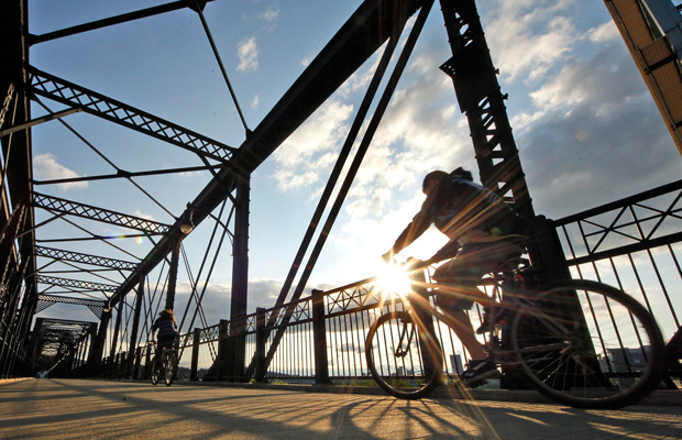 Cyclists cross the Hot Metal Bridge over the Monongahela River during the evening rush hour. (AP/Gene J. Puskar)