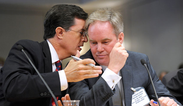 Comedian Stephen Colbert, left, confers with his attorney Trevor Potter as he testifies before the Federal Election Commission on June 30, 2011. Colbert once formed a “dark-money” organization called “Colbert Super PAC SHH.” (AP/Cliff Owen)