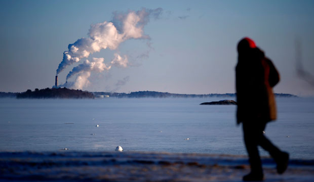 Plumes of steam blow from the Wyman Station power plant on Cousins Island in Yarmouth, Maine. (AP/Robert F. Bukaty)