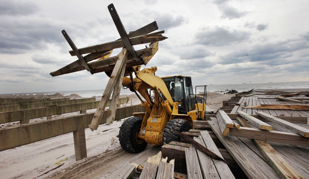 Three months after superstorm Hurricane Sandy devastated the coastal areas of New Jersey and New York, the U.S. Congress finally passed a $50.5 billion bill to rebuild homes, businesses, utilities, mass transit, and other critical infrastructure. (rebuilding New York boardwalk)