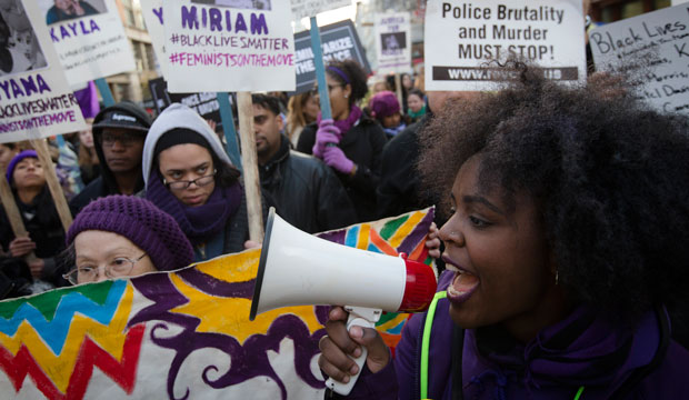 Demonstrators march in New York on December 13, 2014, during the Justice for All rally and march. (AP/John Minchillo)