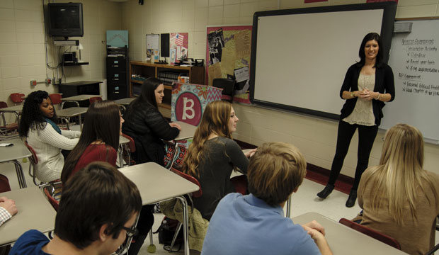 Teacher Sheri Brown talks to a group of students in her classroom in Guntersville, Alabama. (Invision/Jeff White)