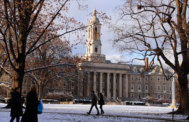 Students walk near Old Main on the Penn State University campus. (AP/Gene J. Puskar)