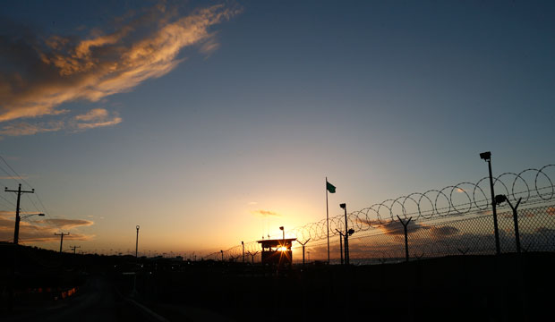 The sun rises above Camp Delta at Guantanamo Bay Naval Base, Cuba, November 2013. (AP/Charles Dharapak)