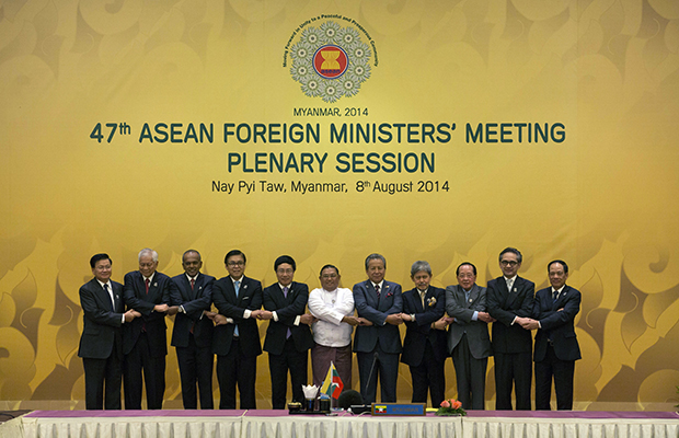 Foreign ministers of the Association of Southeast Asian Nations pose for a group photo before commencing the plenary session of the 47th ASEAN Foreign Ministers meeting in Nay Pyi Taw, Myanmar, August 8, 2014. (AP/Gemunu Amarasinghe)