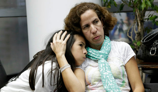 Isabella Roseta sits with her daughter Vanessa during a Florida Immigrant Coalition meeting about President Obama's executive order on immigration. (AP/Lynne Sladky)