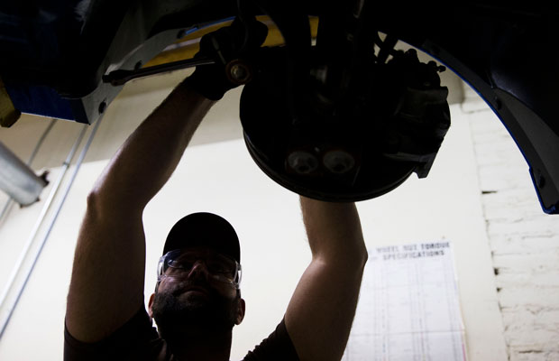 An automotive service technology student works on a car at the Community College of Philadelphia. (AP/Matt Rourke)