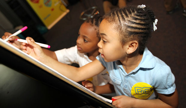 Children learn about illustration and storytelling at Joint Base Andrews in Prince George’s County, Maryland. (AP/Paul Morigi)