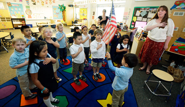 Children in a prekindergarten class recite the pledge of allegiance at the start of the school day in Tacoma, Washington. (AP/Ted Warren)