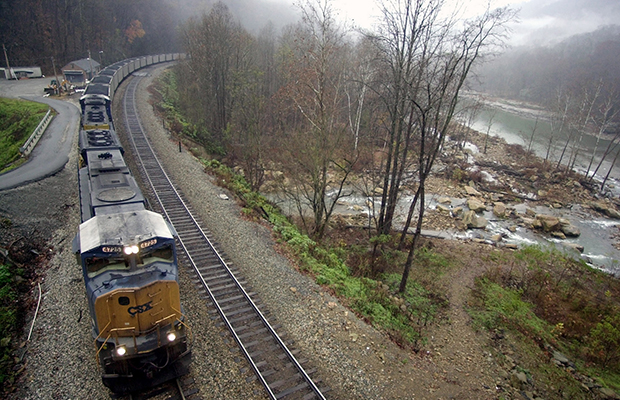 A train loaded with coal winds its way into the mountains near the New River at Cotton Hill in Fayette County, West Virginia, November 2004. (AP/Jeff Gentner)