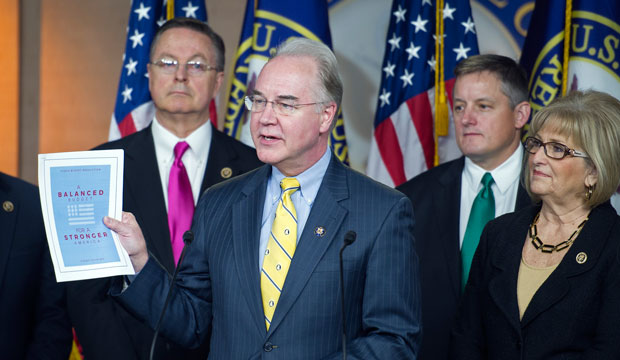 House Budget Committee Chairman Tom Price (R-GA) holds up a synopsis of the House Republican leadership's budget proposal on Capitol Hill on March 17, 2015. (AP/Cliff Owen)