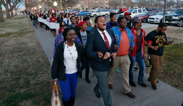 University of Oklahoma students march to the now-closed Sigma Alpha Epsilon fraternity house during a rally on March 10, 2015. (AP/Sue Ogrocki)