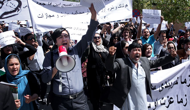 Civil-society activists in Kabul, Afghanistan, chant slogans during a September 2014 rally. (AP/Massoud Hossaini)