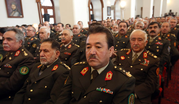Afghan security officers listen to a speech by President Ashraf Ghani. (AP/Rahmat Gul)