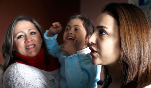 Claudia Ramon and her daughters Isabella and Camila speak outside a town hall forum in Houston. The meeting was held despite an injunction from a federal judge in Texas blocking President Obama’s executive orders on immigration. (AP/Pat Sullivan)