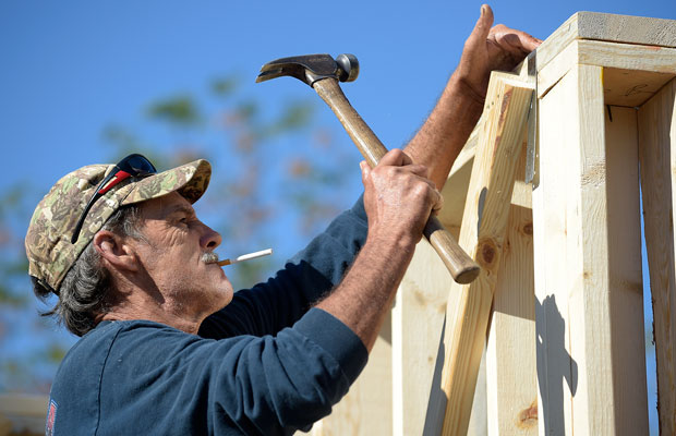 Construction worker David Rager frames the upper floor of a two-story custom home being built in Orlando, Florida, February 13, 2015. (AP/Phelan M. Ebenhack)