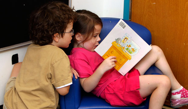 Pre-K students read a book at the Walden Early Childhood Center at Emory University in Atlanta, Georgia. (AP/John Bazemore)