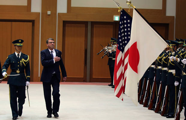 U.S. Defense Secretary Ash Carter is escorted to inspect an honor guard at the Defense Ministry in Tokyo, Wednesday, April 8, 2015. (AP/Eugene Hoshiko)