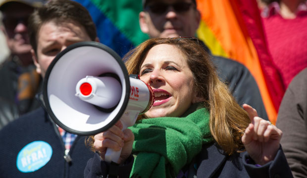 Indiana State Rep. Christina Hale addresses a crowd of opponents to Indiana's Religious Freedom Restoration Act on the lawn of the Indiana State House on March 28, 2015. (AP/Doug McSchooler)