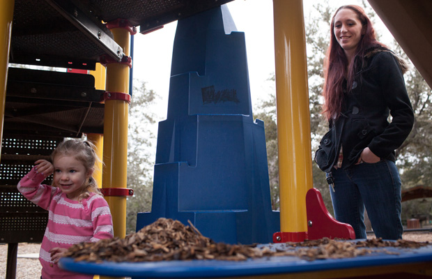 Maggie Barcellano plays with her three-year-old daughter at Lakeway City Park in Lakeway, Texas. (AP/Tamir Kalifa)