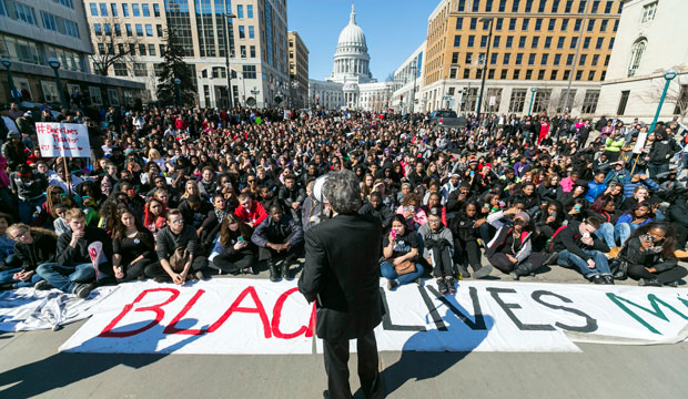 Madison, Wisconsin, Mayor Paul Soglin (D) addresses a crowd of protestors on Martin Luther King Jr. Boulevard in Madison on March 9, 2015, during a protest of the shooting death of Tony Robinson. (AP/Andy Manis)