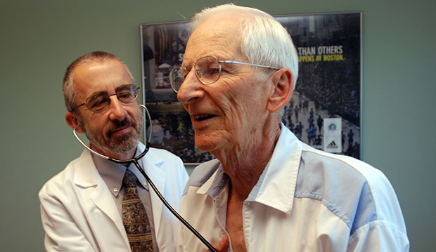 A doctor is shown examining a patient in June 2012. (AP/Jeff Barnard)