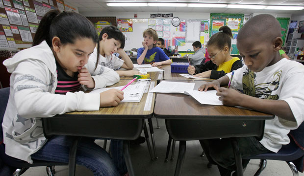 Third-grade students do school work during class at Hanby Elementary School in Mesquite, Texas, February 2011. (AP/LM Otero)