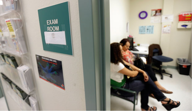 Two women wait in an exam room at Nuestra Clinica Del Valle, in San Juan, Texas, on July 12, 2012. (AP/Eric Gay)