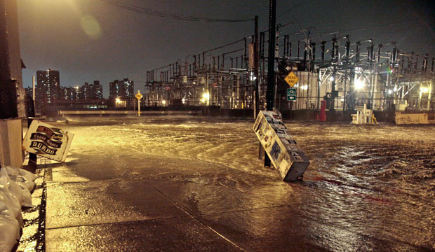 The East River overflows into the Dumbo section of Brooklyn in New York during Superstorm Sandy, October 2012. (AP/Bebeto Matthews)
