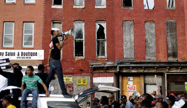 A protester leads marchers in a chant in Baltimore on Saturday, May 2, 2015, a day after charges were announced against the police officers involved in Freddie Gray's death. (AP/Patrick Semansky)