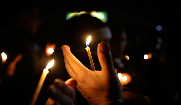 People take part in a candlelight vigil in Ferguson, Missouri, March 12, 2015. (AP/Jeff Roberson)