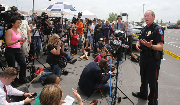 Waco Police Sgt. Patrick Swanton addresses the media as law enforcement continues to investigate the motorcycle gang related shooting on May 18, 2015, at the Twin Peaks restaurant in Waco, Texas. (AP/Jerry Larson)